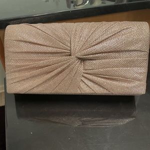 Golden clutch bag with chain link shoulder strap